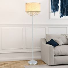 a living room scene with focus on the floor lamp