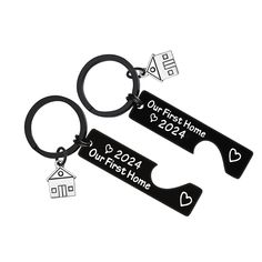 two personalized key chains with houses and hearts on them, one is for the first home