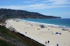 people are playing volleyball on the beach