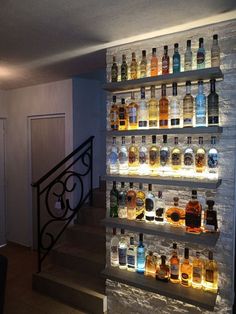 there are many bottles of alcohol on the wall