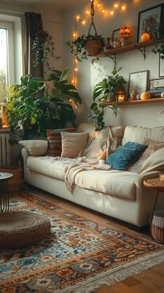 a living room filled with furniture and lots of plants