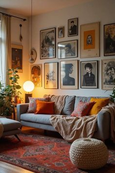 a living room filled with furniture and pictures on the wall