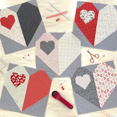 several pieces of fabric with hearts cut out on them, including scissors and yarns