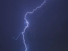 a lightning strike is seen in the sky