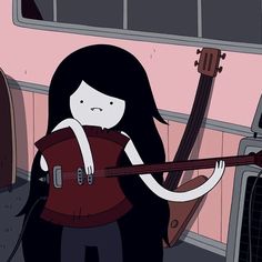 a girl with long black hair holding a guitar