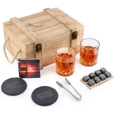 a wooden box with two glasses and coasters next to it