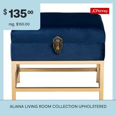 a blue ottoman sitting on top of a wooden table next to a sign that says, $