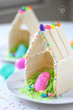 an easter egg house made out of wafer paper and decorated with sprinkles