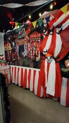 a circus themed birthday party with clowns and striped tablescloths on the walls