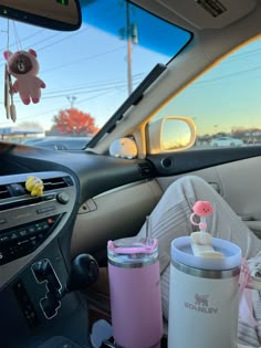 the interior of a car with baby items in it