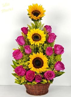 sunflowers and roses in a basket with pink roses on the bottom, yellow flowers at the top