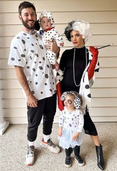 a man, woman and child are dressed up in costumes for halloween with polka dots on them