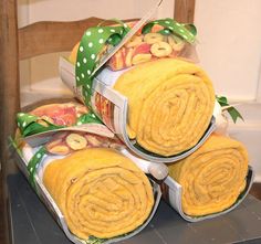 there are three rolls of food wrapped in paper on top of each other and tied together