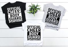 Welcome to Maddy Paddy Designs Etsy Shop! This listing is for a official cheer body guard # fear the bro shirt. The body suit only comes in Athletic Heather, white and black at this time. *If you would like to see the design on a different style shirt, please do not hesitate to ask. Solid Colors  * 100% Cotton Athletic Heather * 90% cotton * 10% polyester  Heather * 52% cotton * 48% polyester I suggest that you measure your shirt that you already own to compare sizing with the size chart in the Cheer Brother Shirts, Body Guard, Cheer Shirt, Cheer Shirts, Brother Shirts, Fan Shirts, Heather White, Style Shirt, Body Suit