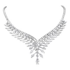 This elegant platinum feather design necklace features round brilliant and marquise diamond vanes emanating from a quill of carefully selected graduating baguettes brought wonderfully together by a single elongated pear shape diamond of approximately 1.75 carats. The piece is further embellished by the addition of six tapered baguettes adorning the clasp. 28 round brilliant diamonds weigh approximately 8.40 carats 28 marquise diamonds weigh approximately 7 carats 125 baguettes weigh approximatel Brides Accessories, Wedding Accessories For Bride, Expensive Diamond, Platinum Bracelet, Bridal Diamond Jewellery, Jewelry Diamonds, Feather Necklace, Diamond Necklaces, Diamond Jewelry Designs