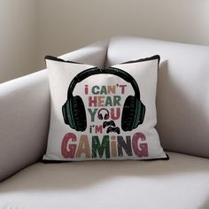 a pillow with headphones on it that says i can't hear you, i'm gaming