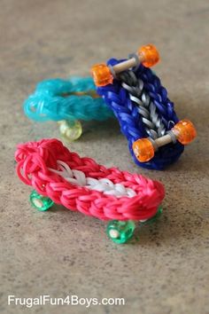 two colorful bracelets sitting on top of a table