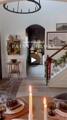 a living room filled with furniture and christmas decorations