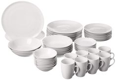 white dishes and cups are stacked on top of each other, with one empty plate in the middle