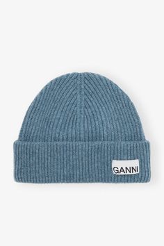 This Blue Fitted Rib Knit Wool Beanie features a folded cuff with a sewn-on GANNI logo patch. GANNI Blue Fitted Rib Knit Wool Beanie in Dusty Blue | Women's Knitted Wool Beanie, Denim Suit, Wool Beanie, New Arrival Dress, Dusty Blue, Patch Logo, Rib Knit, Accessories Hats, Dress Shoes