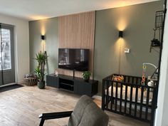 a living room filled with furniture and a flat screen tv on top of a wall