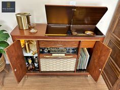 an old fashioned record player in a wooden cabinet