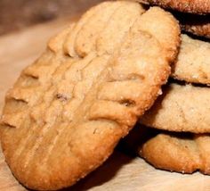 a pile of cookies sitting on top of a wooden table