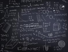 a blackboard with lots of calculations written on it