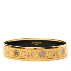 Medium Herms Paris Bangle In Printed Enamel With Gold Plated Hardware. Never Worn Sz 65 Made In France Diameter: 2.6" | Width: 0.5" This Width Is Larger Than The Standard Narrow Enamel Bracelet. (I Am Not Sure, But I Think Herms Discontinued This Size.) Soft Yellow And Blue With Gold I Am Also Selling The Coordinating Wide Enamel Bracelet, And Narrow Enamel Bracelet. (Each Sold Separately). They Look Stunning Worn Together! Luxury Vintage Jewelry With Enamel, Mellerio Jewelry, Luxury Enamel Bracelet, Luxury Enamel Bangle Bracelets, Luxury Gold Enamel Bangle, Vintage Gold Enamel Bracelets, Hermes Bangle, Hermes Bracelet, Hermes Jewelry