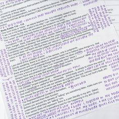 a close up of some type of text on top of papers with words written in them