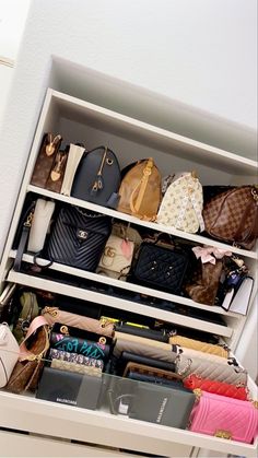 an organized closet with handbags and purses