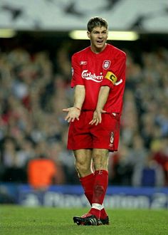 a soccer player is standing on the field