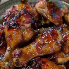 chicken wings covered in bbq sauce and garnished with parsley