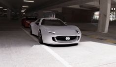 a silver car parked in a parking garage