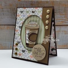 a close up of a greeting card with a coffee cup on the front and bottom