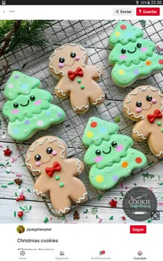 some cookies that are sitting on a wire rack and one is decorated with icing