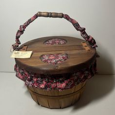 a wooden basket sitting on top of a table