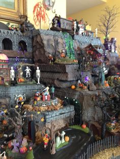 a display in a store filled with lots of fake figurines and halloween decorations