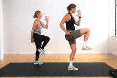 two women doing squats on yoga mats