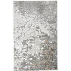 a gray and white rug with lots of spots on it