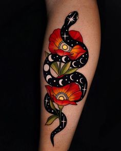 a woman's arm with flowers and a snake tattoo on the left side of her body