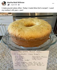 a cake sitting on top of a glass platter next to a note that says martha friedthrow