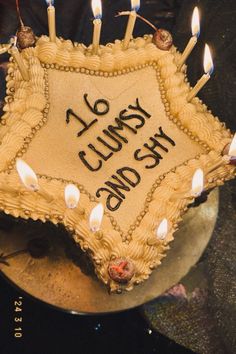 a cake that has candles on it with the words twenty and sixty