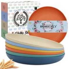 a stack of colorful plates sitting in front of a box with the words homiey on it