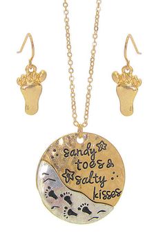 Sandy Toes & Salty Kisses is the message on this Beach Theme Necklace and Earring Set
Round Pendant Size:; 1"" (approx)
Earring Pendant Size:  .38"  X  .57"  (approx)
Chain Length:; 18"  Extended (approx)
Made of metal alloy (silver and copper and other metal alloy) with high quality plating
Lead and Nickel Compliant Metal Beach Jewelry With Matching Earrings, Ocean-inspired Dangle Jewelry For Beach Season, Sand-colored Beach Season Jewelry, Ocean-inspired Charms Necklaces For Beach, Summer Beach Ocean-inspired Charm Necklaces, Necklace And Earring Set, Beach Themed, Beach Theme