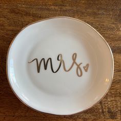 a white plate with the word mr and mrs written in cursive writing on it