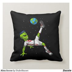 an alien soccer player is kicking the ball throw pillow from zazzle com, click to see more images here