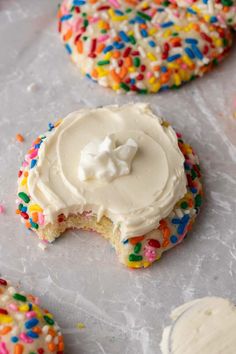 sprinkled cookies with frosting and colored sprinkles