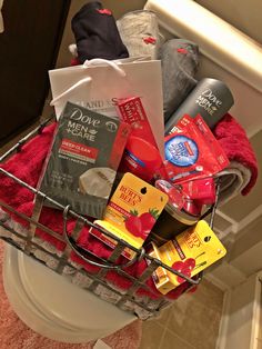 a basket filled with items sitting on top of a toilet