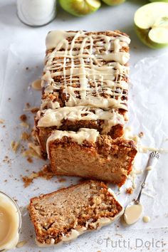 sliced loaf of cinnamon apple bread with icing